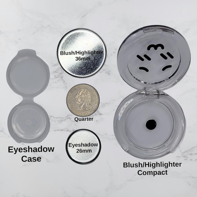 May include: An assortment of makeup containers and components. Includes an open eyeshadow case, a quarter, and a blush/highlighter compact. The blush/highlighter is 36mm in diameter, and the eyeshadow is 26mm. The compact is open, revealing the product.