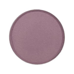 May include: A round, matte eyeshadow pan in a muted mauve color. The eyeshadow is encased in a silver metal compact. The product is isolated on a white background, highlighting the color and texture of the makeup.