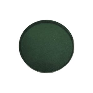 May include: A round container filled with a dark green powder.