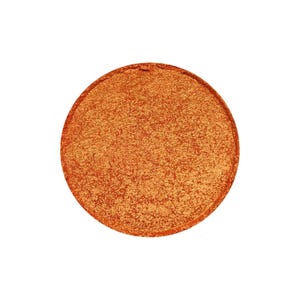 May include: A round, orange eyeshadow with a shimmery finish.