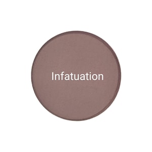 May include: A circular eyeshadow pan in a muted mauve shade. The word "Infatuation" is printed in white across the centre. The eyeshadow is presented on a plain white background.