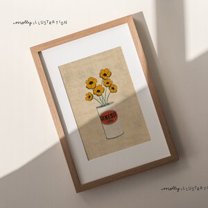 May include: A framed illustration of a bouquet of yellow flowers in a white can with the word "Genesee" printed on the side. The background is a light beige color.