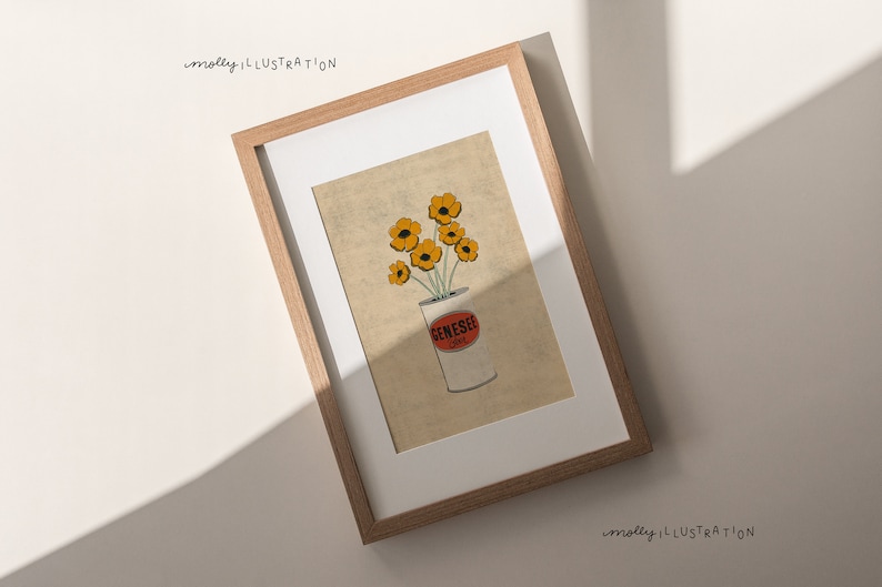 May include: A framed illustration of a bouquet of yellow flowers in a white can with the word "Genesee" printed on the side. The background is a light beige color.