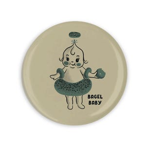 Imán con dibujo animado de un bebé bagel