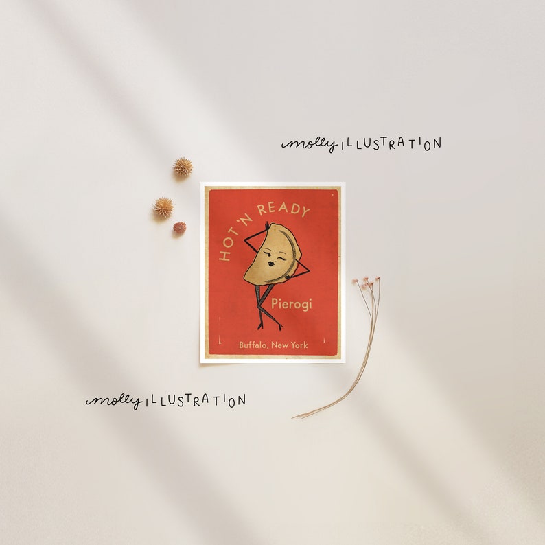 May include: A red and white illustration of a pierogi with a face and arms, with the text "HOT 'N READY" and "Pierogi" on the illustration. The text "Buffalo, New York" is also on the illustration.