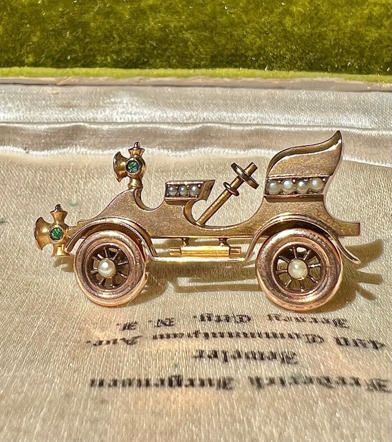 Car brooch discount