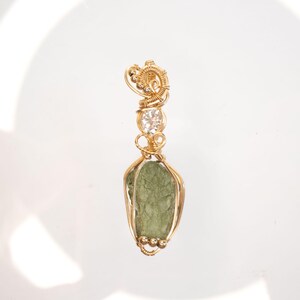 Moldavite with Moissanite Gold pendant, wire wrapped in 14k gold filled wire Moldavite with certificate from Czech Republic.