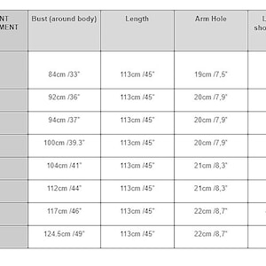 May include: A size chart for a garment with measurements in inches and centimeters. The chart shows the bust, length, arm hole, and length from shoulder to under bust for sizes XS, S, S/M, M, M/L, L, XL, and XXL.