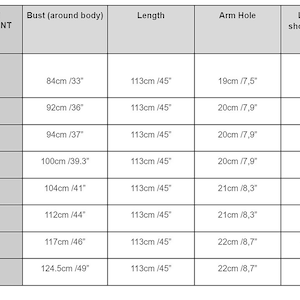 May include: A size chart for clothing with measurements in inches and centimeters. The chart shows bust, length, arm hole, and length from shoulder to under bust measurements for sizes XS, S, S/M, M, M/L, L, XL, and XXL.