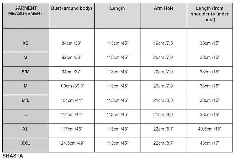 May include: A size chart for clothing with measurements in inches and centimeters. The chart shows bust, length, arm hole, and length from shoulder to under bust measurements for sizes XS, S, S/M, M, M/L, L, XL, and XXL.