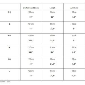 May include: Size chart for clothing with measurements in inches and centimeters. The chart shows bust, length, and arm hole measurements for sizes XS, S, S/M, M, M/L, and L.