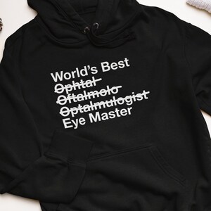 Regalo para oftalmólogo: el mejor oftalmólogo del mundo. Sudadera unisex con capucha Eye Master. Taza de té para el Dr.