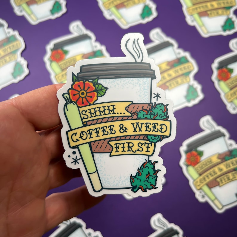 May include: A white sticker with a cartoon illustration of a coffee cup, a joint, and a flower. The text reads "SMMH... COFFEE & WEED FIRST."