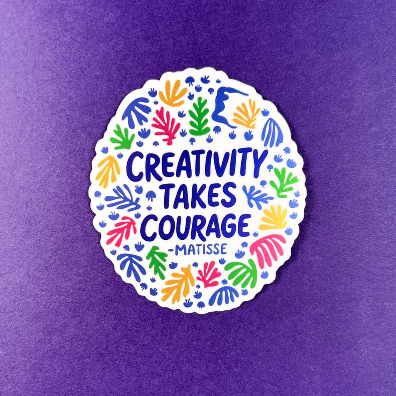 May include: A white, oval sticker with a scalloped edge, featuring colorful Matisse-style leaf and abstract shapes in blue, yellow, pink, and green. The text "CREATIVITY TAKES COURAGE -MATISSE" is in blue, centered within the design, on a purple background.