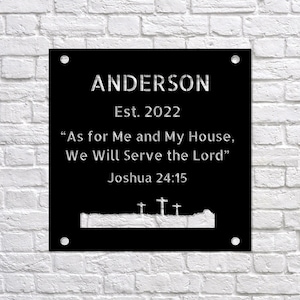 May include: Black metal sign with white text that reads "ANDERSON Est. 2022 "As for Me and My House, We Will Serve the Lord" Joshua 24:15". The sign features a silhouette of a horizon with crosses.