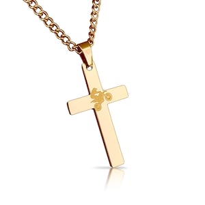 May include: Gold-tone stainless steel cross necklace with a small engraved image of a person riding a dirt bike.