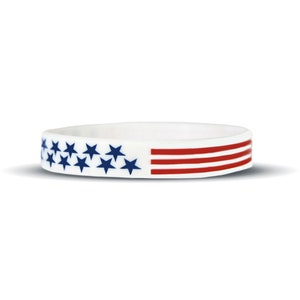 May include: White silicone bracelet with a blue and red American flag design.