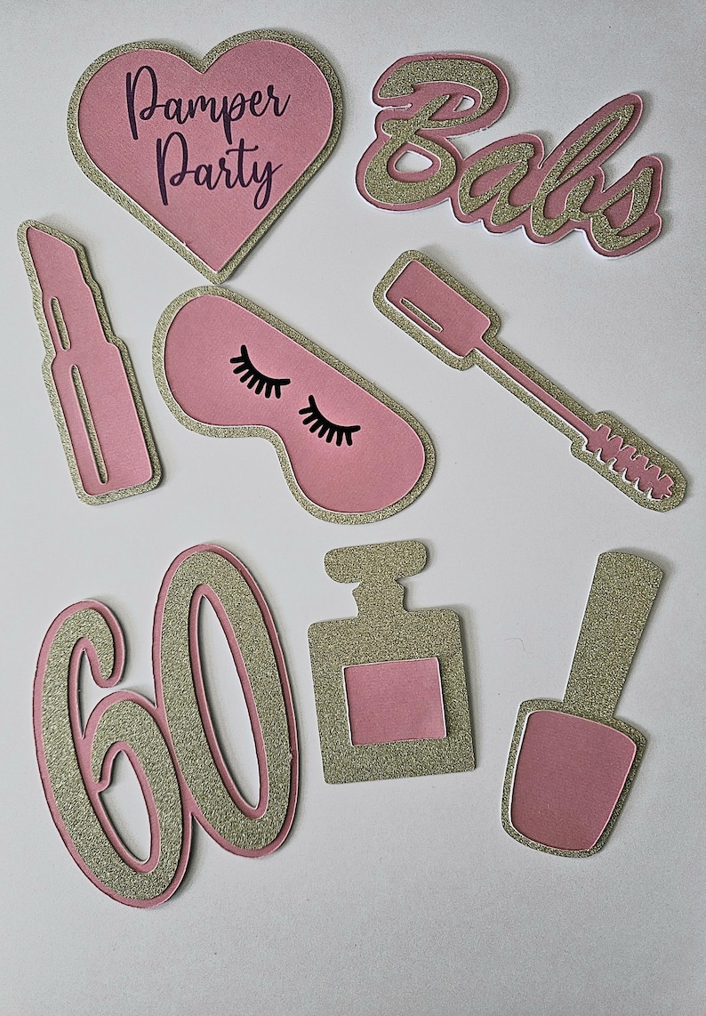 May include: Pink and gold glitter paper cutouts for a pamper party. The cutouts include the words "Pamper Party", "Babs", and the number "60". Other cutouts include a lipstick, eye mask, perfume bottle, and nail polish.