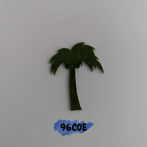 May include: A green palm tree cutout, a popular craft supply for scrapbooking, card making, and other paper crafts.