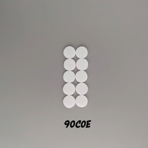 May include: A row of 12 white round stickers arranged in two columns of six stickers each. The text "90COE" is printed below the stickers.