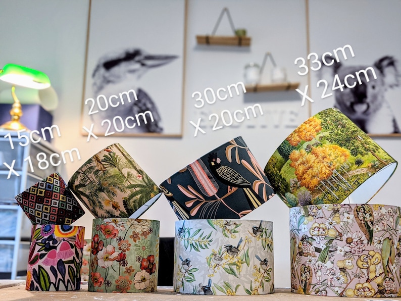 May include: A collection of lampshades in various sizes and patterns. Dimensions are provided in centimeters: 15cm x 18cm, 20cm x 20cm, 30cm x 20cm, and 33cm x 24cm. Designs include floral, botanical, and geometric prints, showcasing a range of colors and styles.