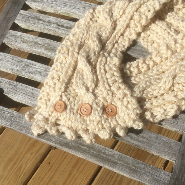 Ivory handknit traditional Fisherman’s  Wife scarf or cowl in cable knit,fastened by three buttons,with crossover end done in picot edging