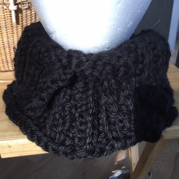 Split collar cowl handknit in black chunky yarn in a thick ribbing to give texture and interest. Great Fall accessory!