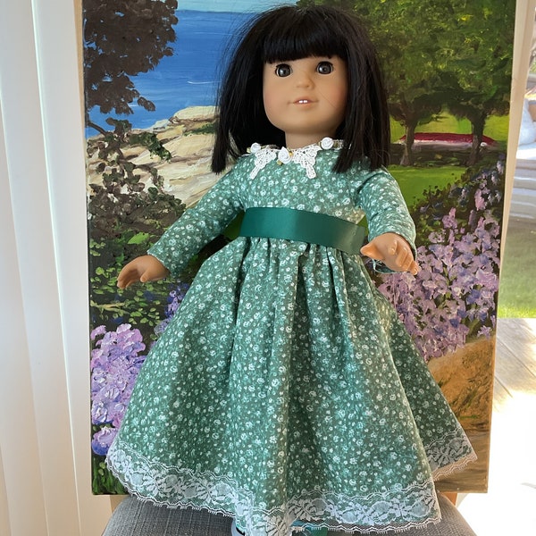 Little Women dress  for 18”doll, trimmed in handsewn lace,flowers,in a fine cotton teal green print,style from mid 1800s,ribbon belt,unique!