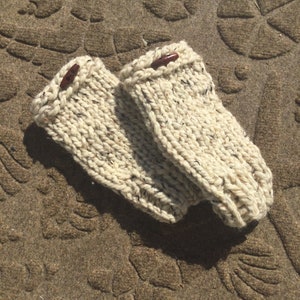 Handknit pair of fingerless gloves done in a chunky oatmeal beige acrylic wool yarn for warmth,style Free shipping.  flecks of black, brown.