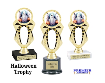 May include: Three Halloween trophies with gold and black accents. Each trophy features a circular image of a ghost and pumpkins. The bases are black, dark grey, and white. Text on the base reads "Free Engraving Up to 2 Lines". The words "Halloween Trophy" are also visible.