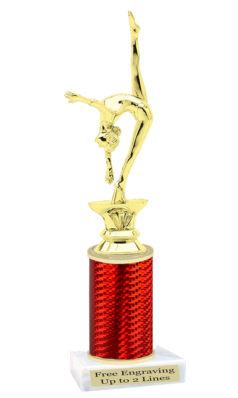 May include: Gold-colored trophy with a gymnast figurine on top. The base is red with a checkered pattern and a white base with the text "Free Engraving Up to 2 Lines".