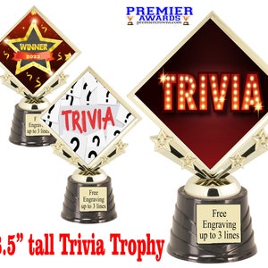 May include: 8.5 inch tall gold trophy with a diamond-shaped base. The base has a red and gold design with the word "TRIVIA" in red letters with light bulbs. The base is on a black base with a gold top. Free engraving up to 3 lines.