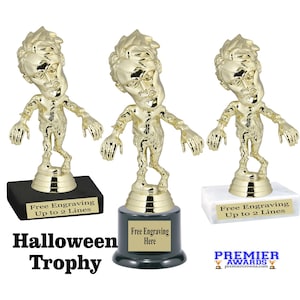 May include: Three gold-colored zombie trophies with outstretched arms and detailed facial features. Each trophy is mounted on a black, green, or white base with a space for engraving. The text "Halloween Trophy" is displayed below.
