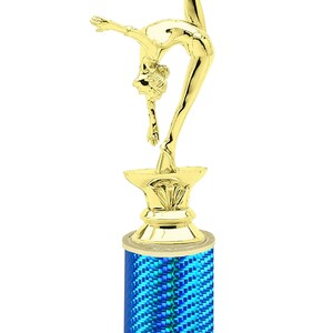 May include: Gold-colored trophy with a gymnast figurine on top. The base is a blue and green cylinder with a white base. The base has the text "Free Engraving Up to 2 Lines".