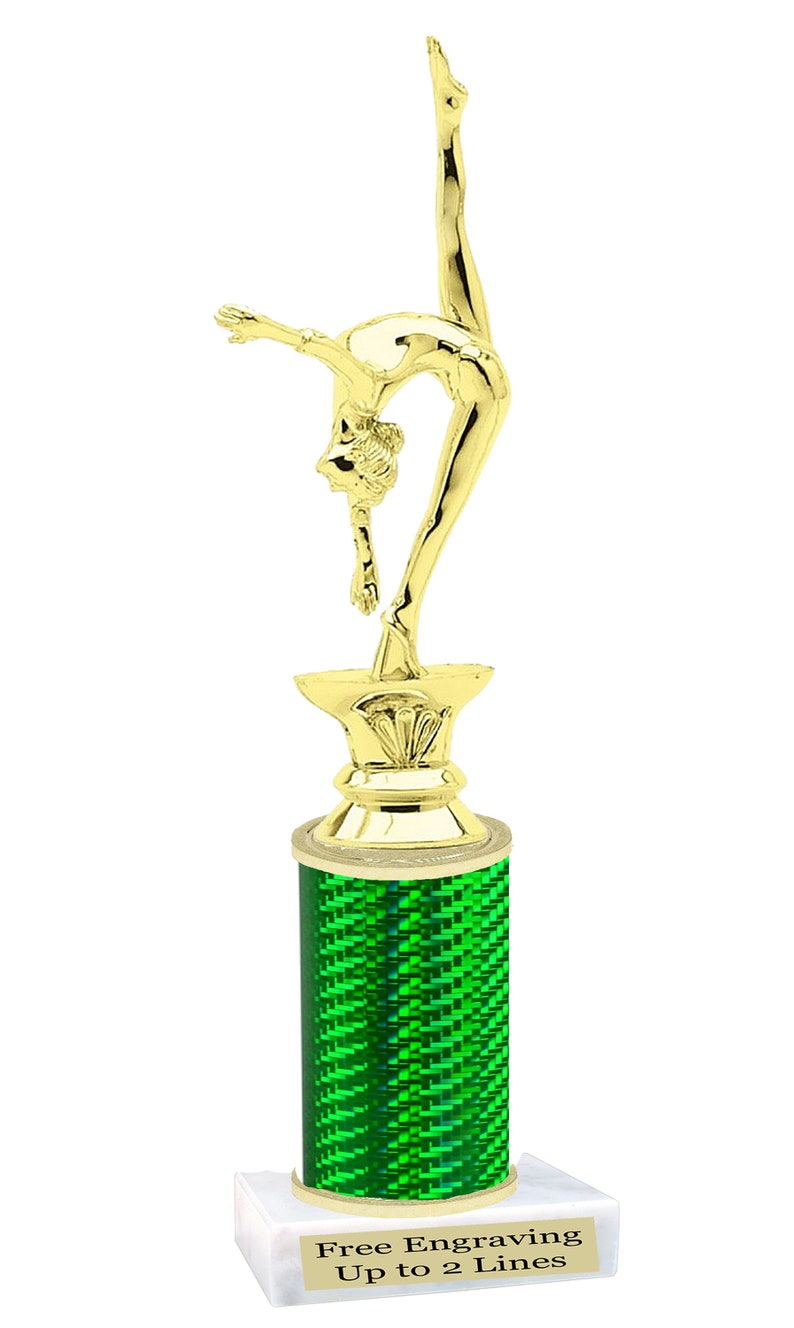 May include: Gold-colored trophy with a gymnast figurine on top. The base is a green cylinder with a white marble base. The base has the text "Free Engraving Up to 2 Lines".