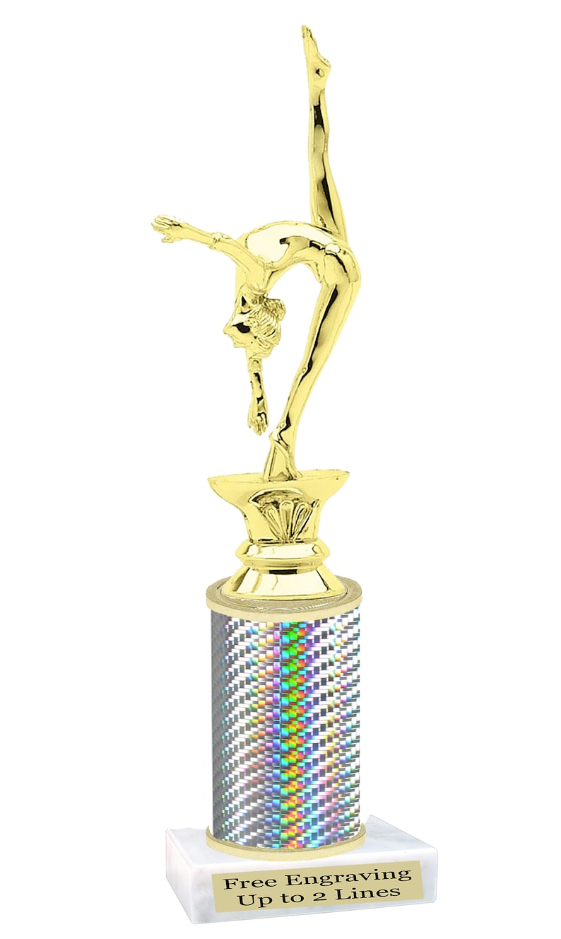 May include: Gold-colored trophy with a gymnast figurine on top. The base is a silver cylinder with a holographic pattern and a white marble base. The base has the text "Free Engraving Up to 2 Lines".