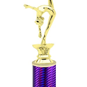 May include: Gold-colored trophy with a gymnast figurine on top. The base is a purple cylinder with a white marble base. The base has the text "Free Engraving Up to 2 Lines".