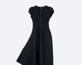 Black petite linen dress with asymmetric hemline. Short-sleeve, tailored linen dress with pockets.