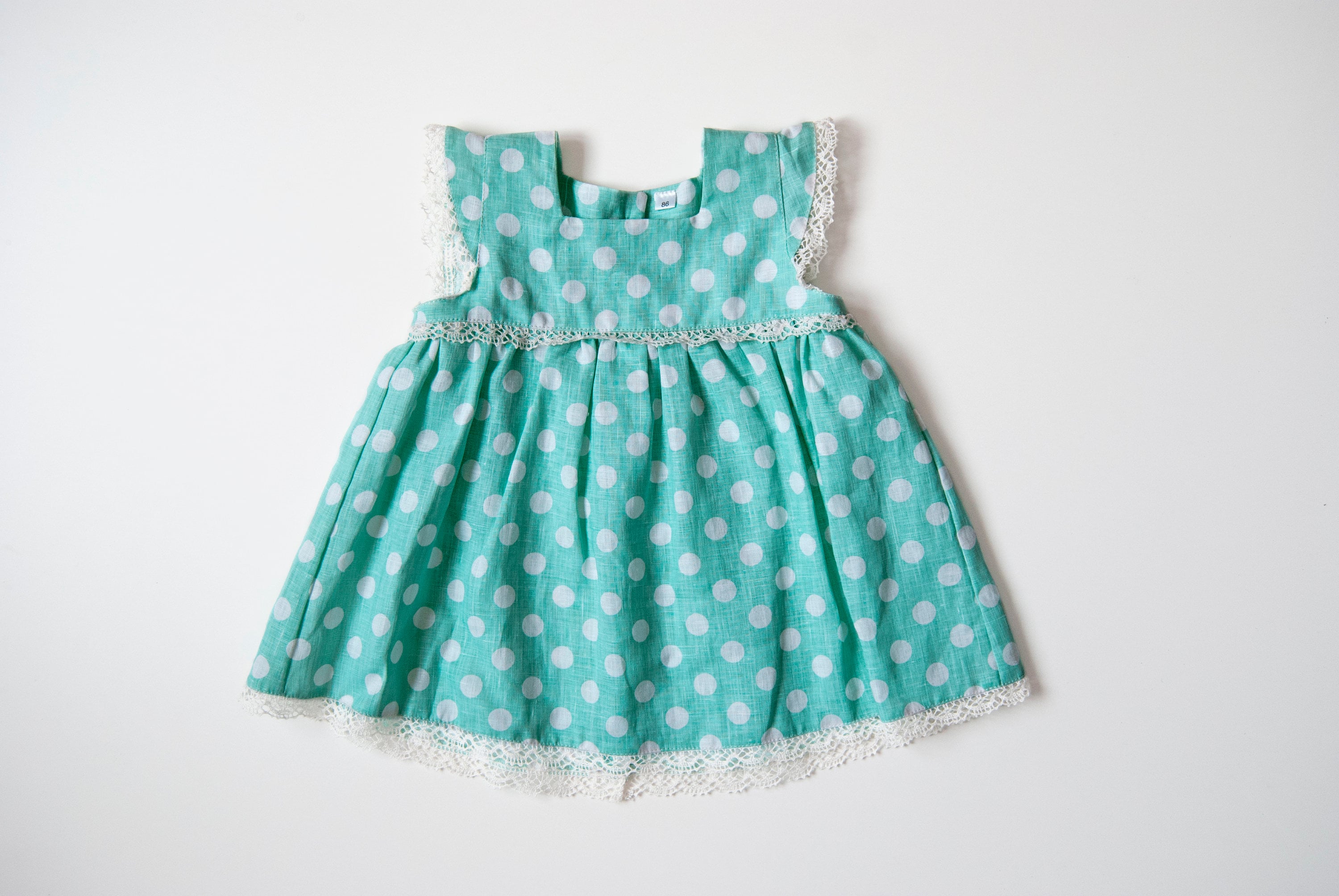 20 Baby Dress Designs for Summer That Are Actually Soft Enough to Wear 7 Baby girl or toddler polka dot dress with white lace made from teal…