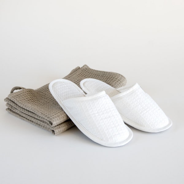 Waffle linen indoor shoes, closed-toe SPA or bath slippers. Hotel, travel, disposable guest slippers
