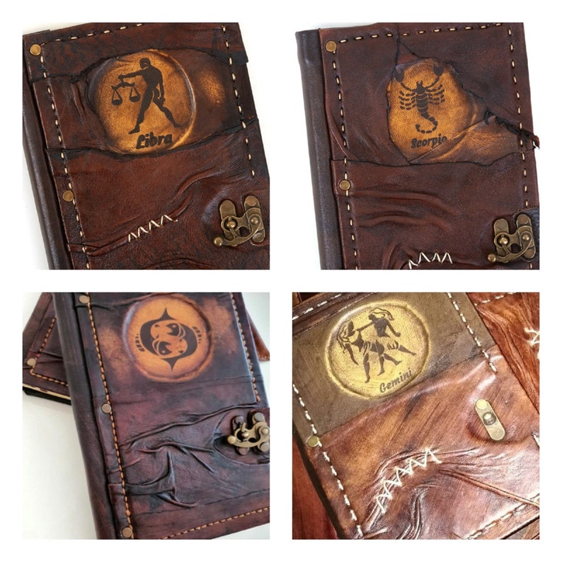 May include: Four brown leather journals with different zodiac signs embossed on the front. The signs are Libra, Scorpio, Gemini, and Pisces.
