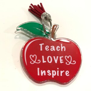 Apple keychain with the words &quot;teach, love, inspire&quot; on it  perfect for a teachers gift, gifting idea, appreciation gift