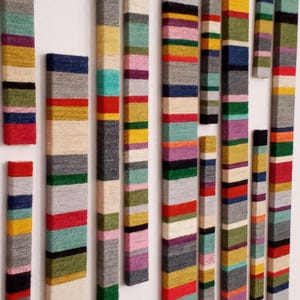 Tall narrow wall art for apartment decor. Maximalist decor as extra large fiber wall art. Long narrow wall art and custom tapestry from jute