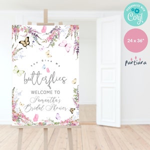 May include: A white welcome sign with a floral border and butterflies. The text reads "You Give Me Butterflies Welcome to Samantha's Bridal Shower".