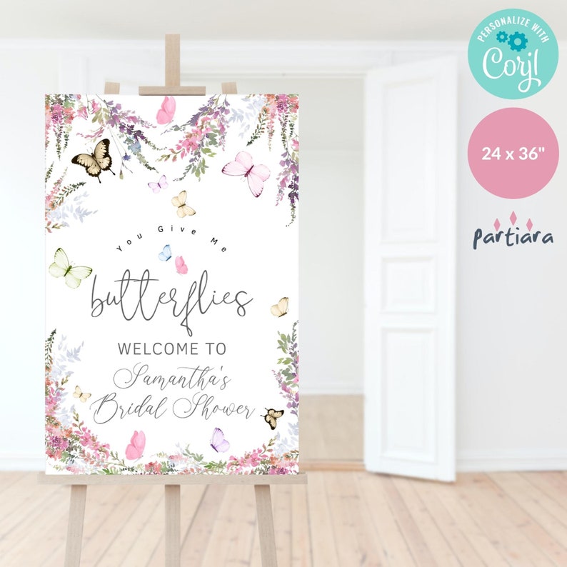 May include: A white welcome sign with a floral border and butterflies. The text reads "You Give Me Butterflies Welcome to Samantha's Bridal Shower".