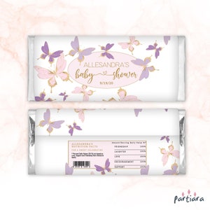 May include: A white chocolate bar wrapper with a pink and purple butterfly design. The wrapper has the text "Alessandra's baby shower 9/19/20" and a nutrition facts label with the text "Friendship, Laughter, Love, Encouragement, Support".