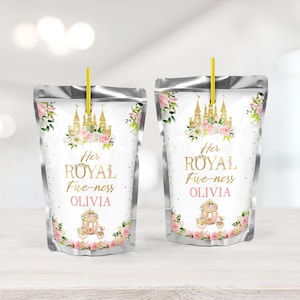 May include: Two silver juice pouches with a white label featuring a pink and gold castle, flowers, and a carriage. The text on the label reads "Her Royal Highness Olivia".