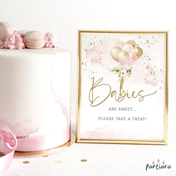 Pink and gold baby shower dessert table 2025