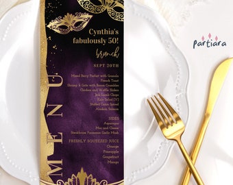 May include: A purple and gold menu card with a masquerade mask design. The text on the card reads "Cynthia's fabulously 50! brunch SEPT 20TH" and lists a menu of brunch items, including shrimp and grits, chicken and waffles, and Alaskan salmon.