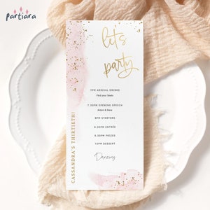 May include: A pink and gold watercolour background with the text "let's party" in gold script. The text "Cassandra's Thirtieth!" is in gold script on the left side of the card. The card lists the schedule for a party, including arrival drinks, opening speech, starters, entree, prizes, dessert, and dancing.